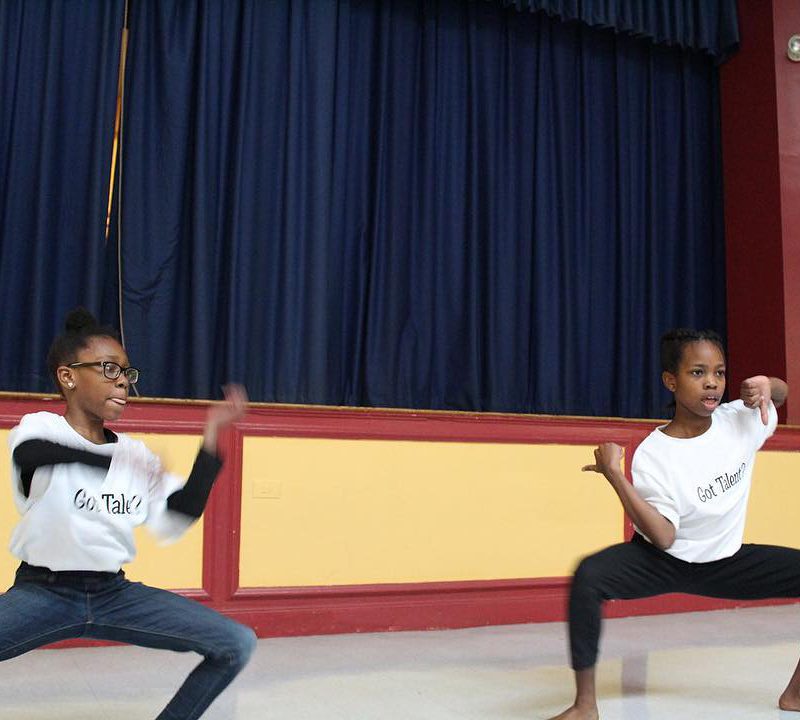Students dance with shirts that read "Got Talent?"