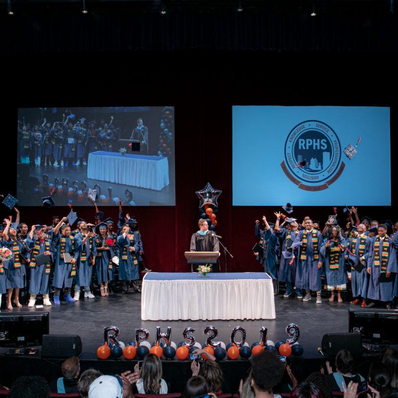 Students gathered on stage for graduation