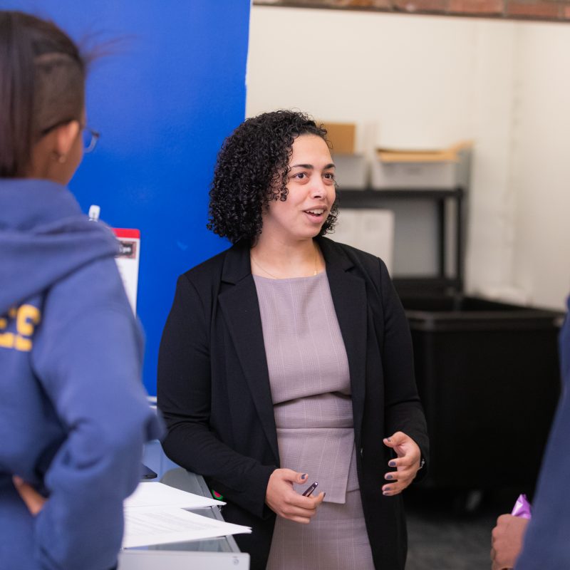 Titciana Barros speaking with students