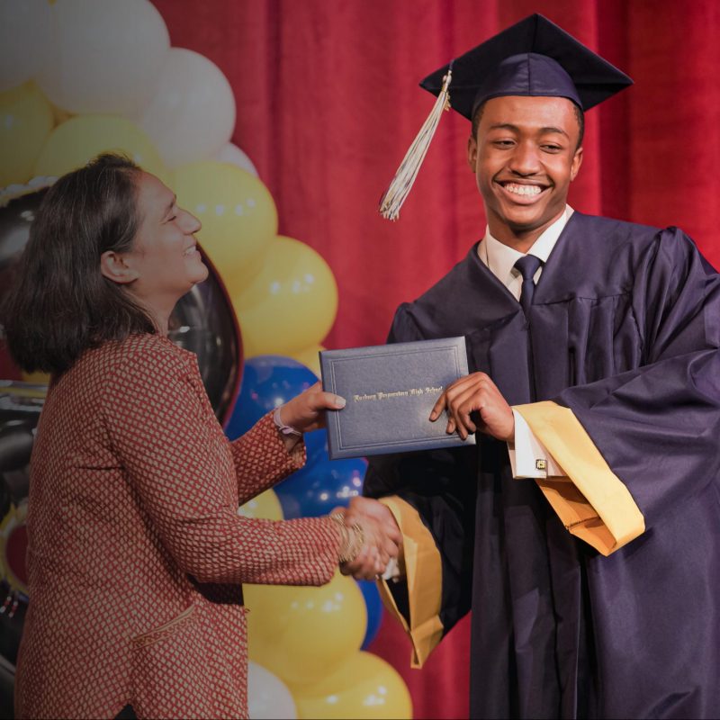 Roxbury Prep graduate accepting his diploma