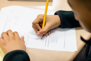 student completing work packet 