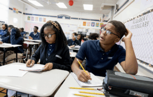 two students working in algebra class