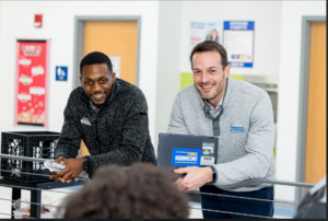two male educators smiling