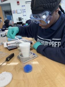 student working on science experiment