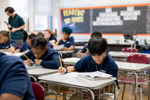 students filling out an assignment in class