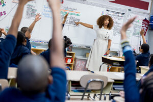 student in the front of the class teaching a lesson